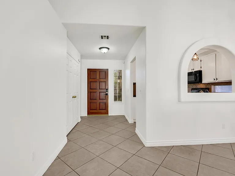 front entry, kitchen on the right