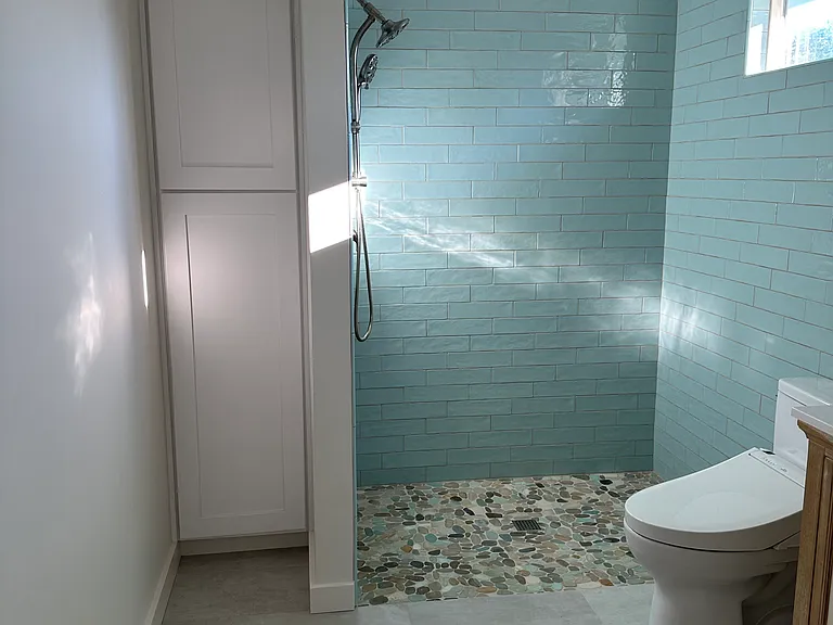 Walk in shower. On demand water heater.
