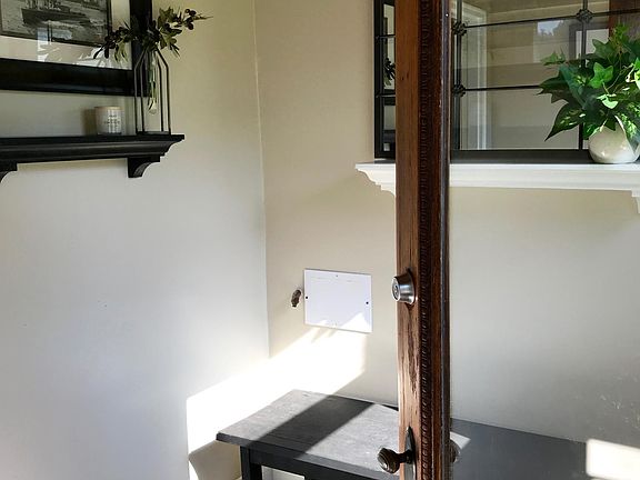 Entry leading into sweet little house.