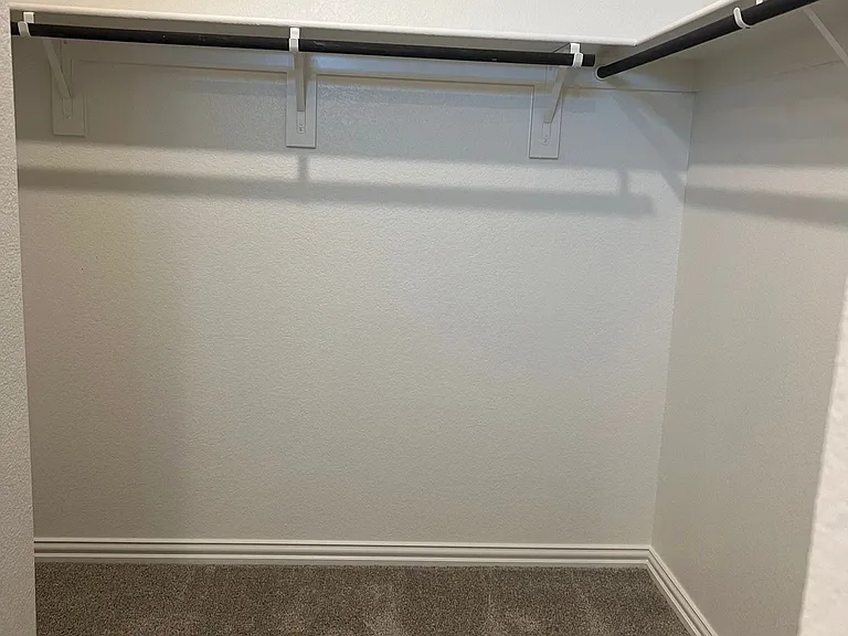 Spacious master bedroom closet.