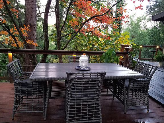 Charming eating area on deck beneath the persimmon tree.