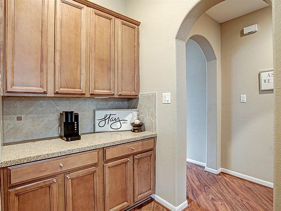 Side entrance into the kitchen area from the front door.