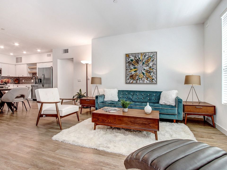 Open floorplan with wood-inspired floors throughout