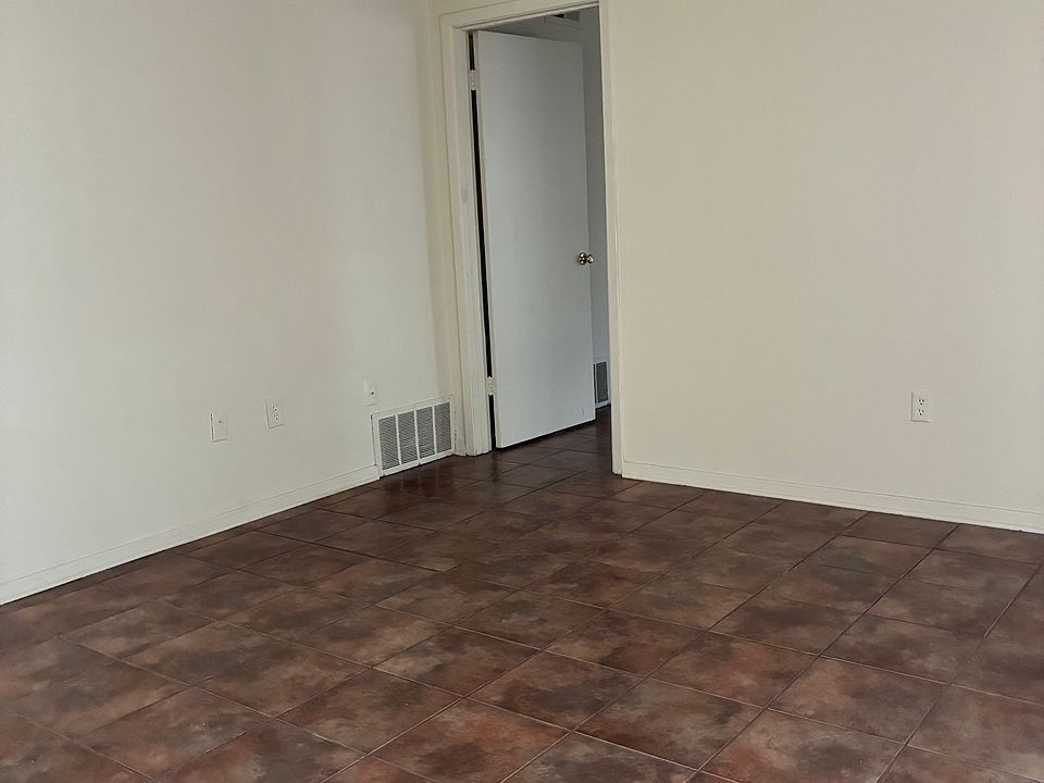 View of living room and entry to bedroom.