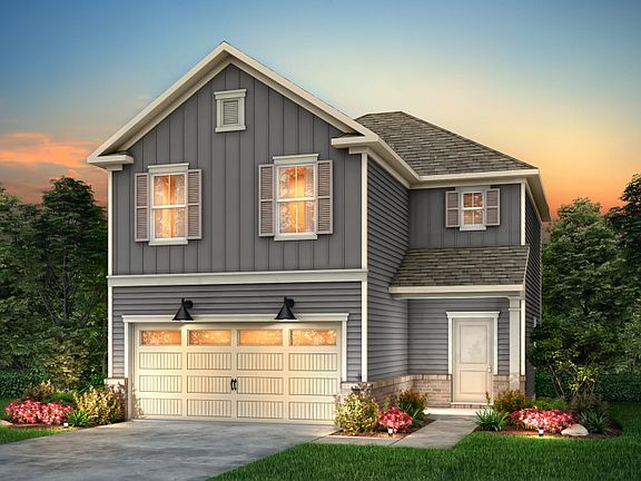 Douglas Exterior LC2G features siding, brick accents, covered front porch and 2 car garage