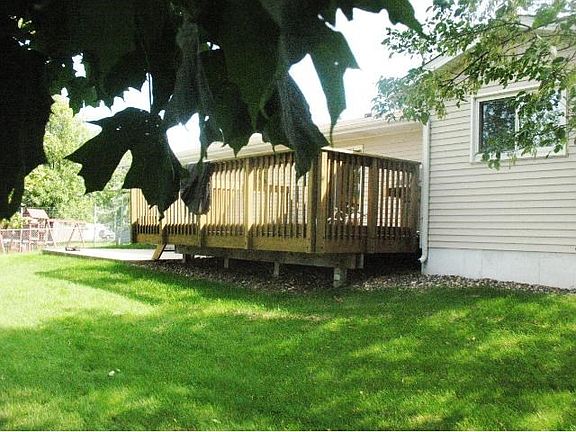 Large fenced yard, Mature trees, Great shade in this back yard.