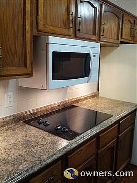 New microwave and glass cooktop.