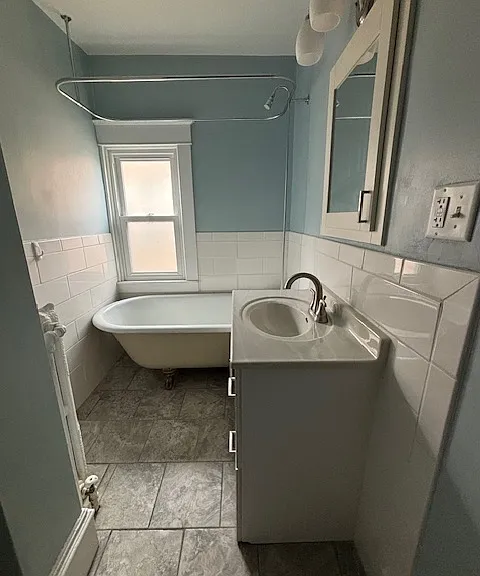 Bathroom.
Tub, shower, and sink.
