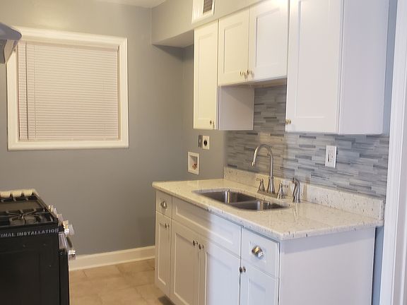 New cabinets. Requires stackable washer and dryer that goes in the kitchen