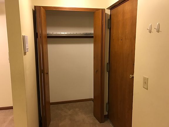 Entry with controlled access intercom and coat closet