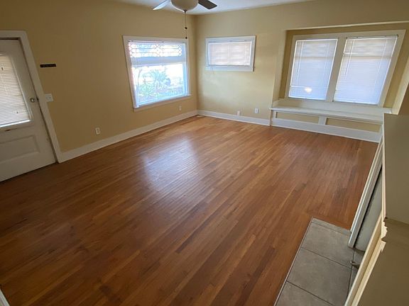 View Of Living Room From Opposite Corner And Entry At Left