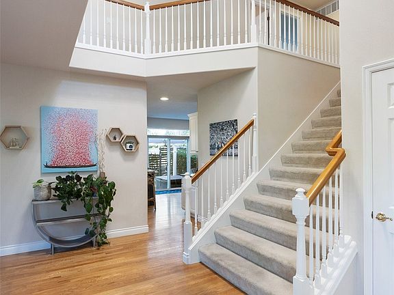large foyer, high ceilings, custom chandelier>