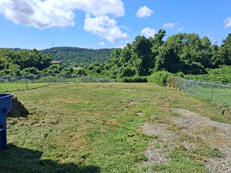 large back yard with full fenced in yard
