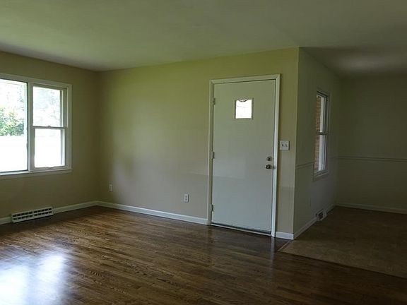 WALK INTO THIS LARGE LIVING ROOM /HARDWOOD FLOORS