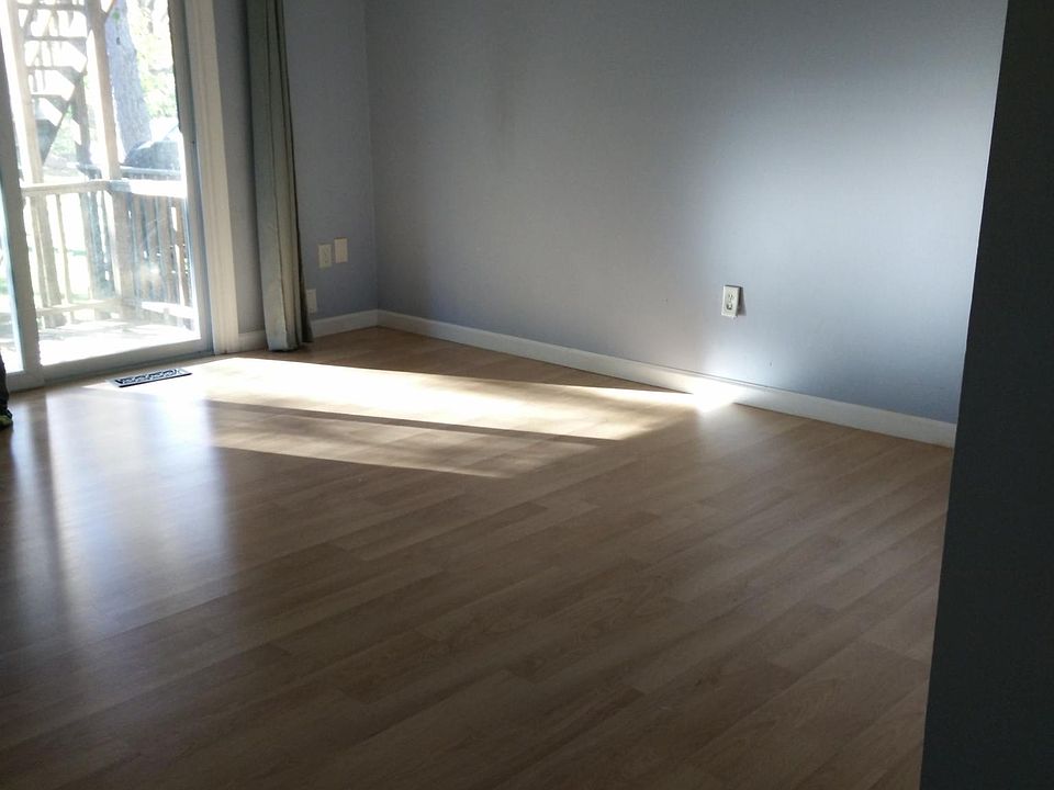 Master bedroom has sliding door that leads to wood deck.
