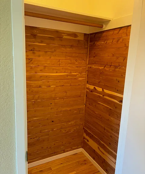 Extra closet by the kitchen at the end of the hallway