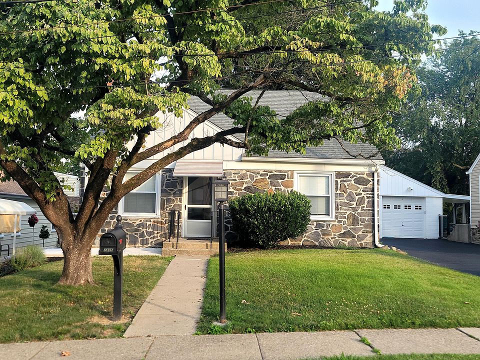 Beautiful house with a nice tree in front for shade.