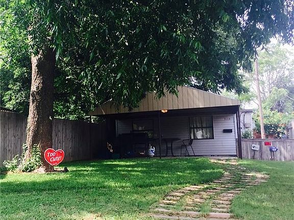 Big shade tree.  Great for playing outside and enjoying the big front yard, that has a sprinkler system already installed.