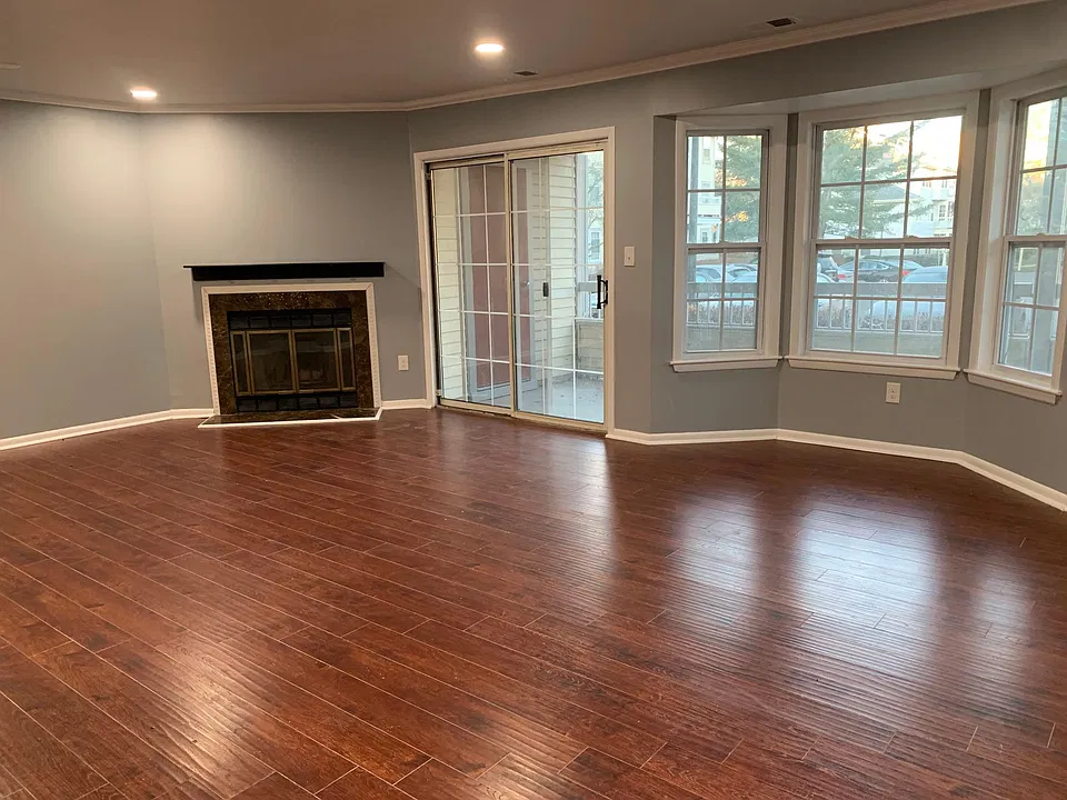 Living room with working Fireplace and view of the separate patio
