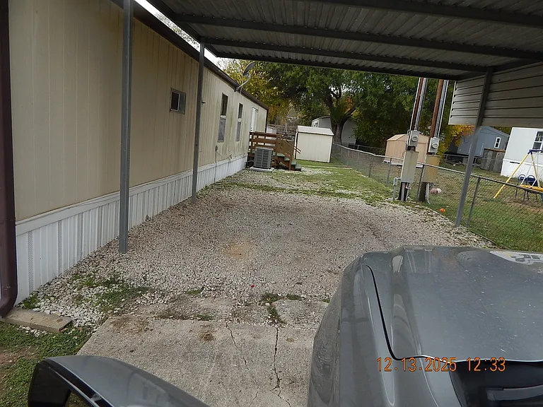 Under large car port - looking to rear of property.