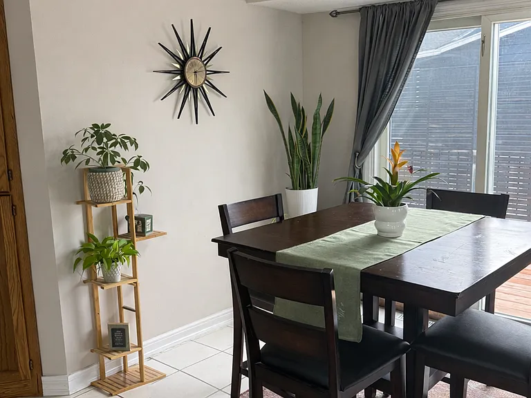 Dining area with high ceilings. This leads out to the newly remodeled deck that leads down to the backyard.