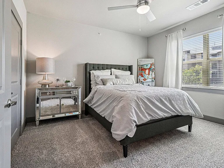 Study and relax in this cozy bedroom designed with students in mind at Discovery Park Apartments.