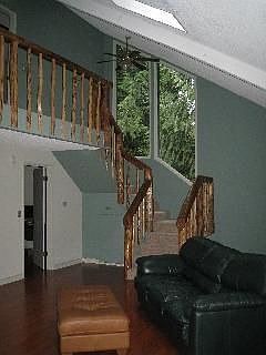 Vaulted ceilings through-out and the log railings are an example of the charm!
