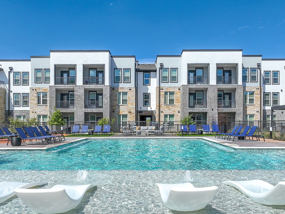 Resort Style Pool with Tan Deck and Loungers