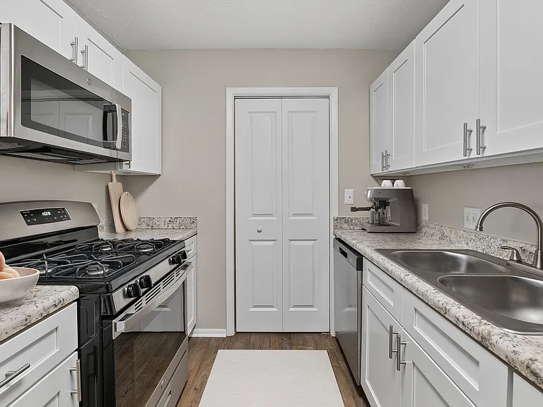 Bright kitchen with modern cabinetry and stainless steel appliances