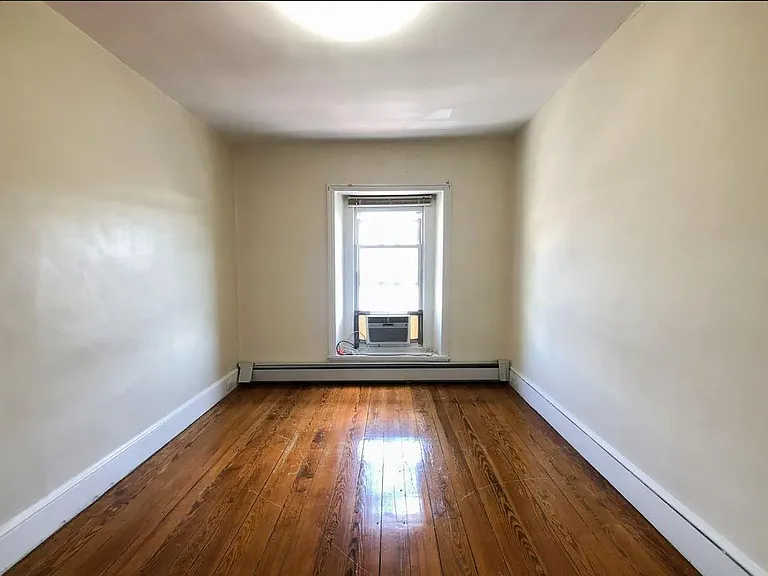 The 2nd-floor bedroom has been refreshed with refinished hardwood floors, a new ceiling fan, and a new window to fill the space with natural light. Updated listing photos coming soon!
