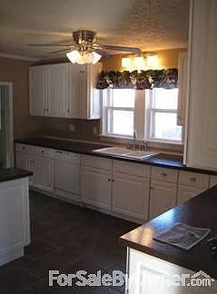 KITCHEN : BUILT IN DISHWASHER, NEW CABINETS, COUNTERTOP, SINK AND GARBAGE DISPOAL