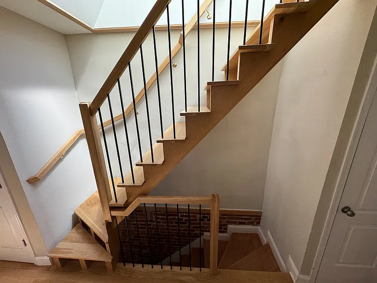 Custom-built stairs to rooftop skylight