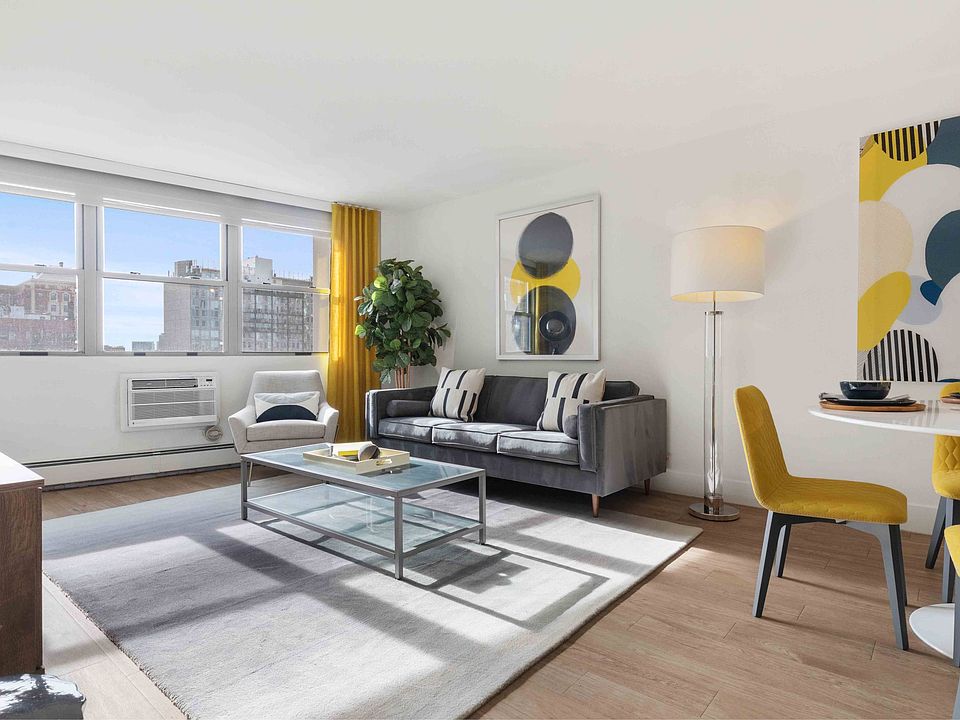 Modern open-concept living area with gorgeous city views