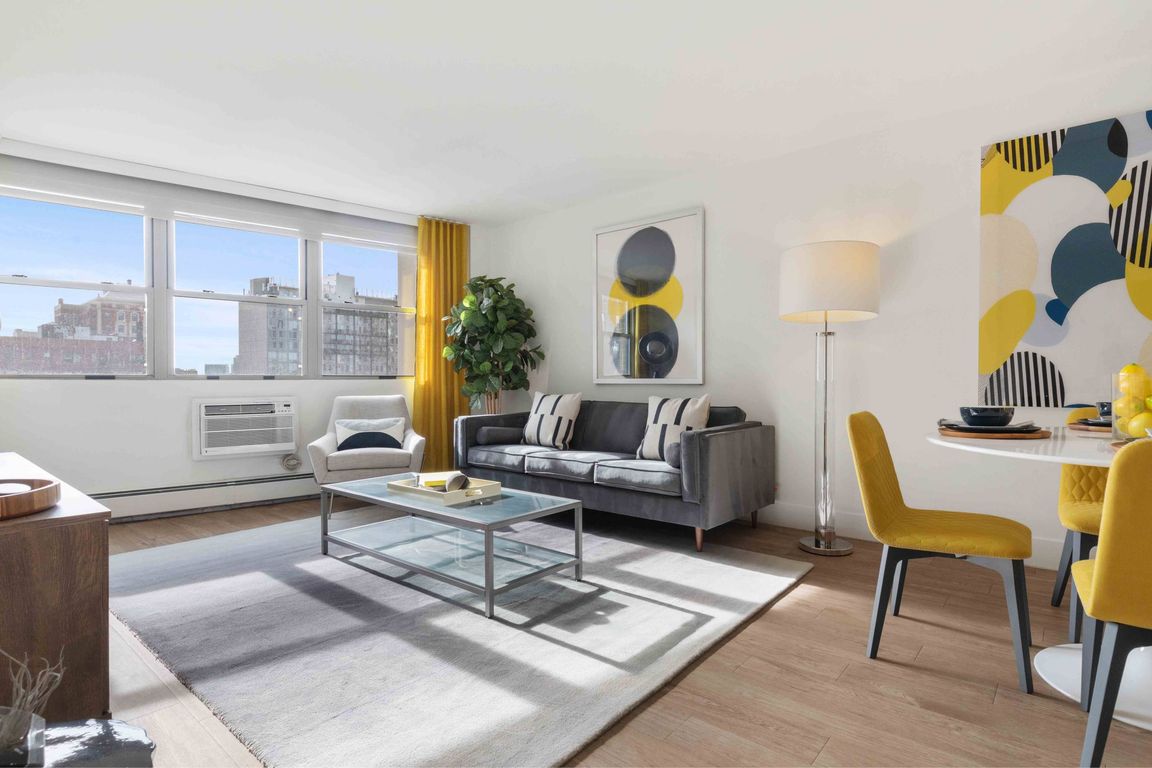 Modern open-concept living area with gorgeous city views