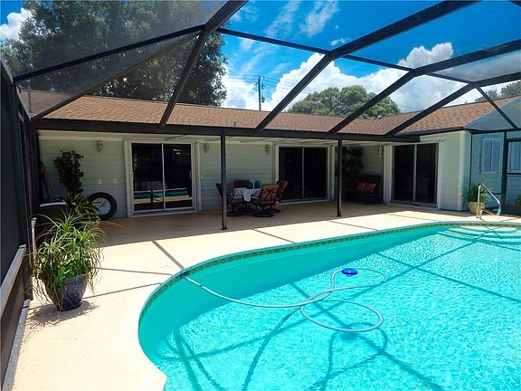 Covered Patio overlooking pool and back yard.