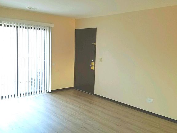 Large, Bright Living Room with Balcony