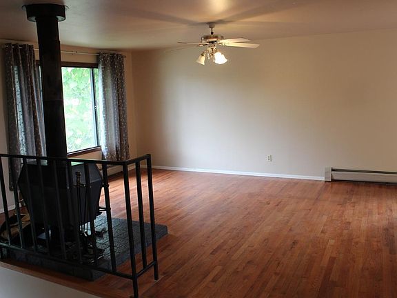 Family room, wood floors & wood burning stove