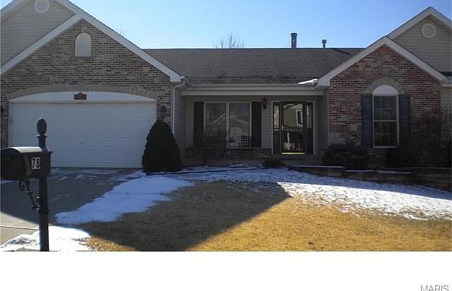Front elevation view. House offers low maintenance exterior with both brick and stone front and sidi