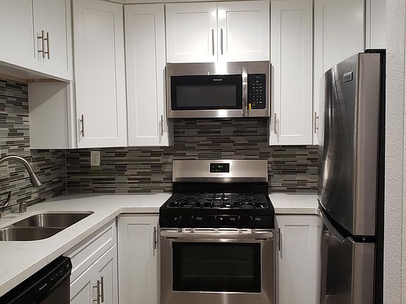 REMODELED KITCHEN WITH GRANITE COUNTER TOPS