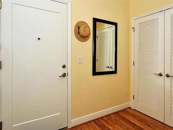 Gracious foyer, high ceilings and warm wood flooring.