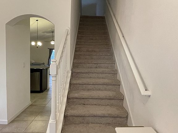 Stairs to 2nd floor & hallway to kitchen/living room
