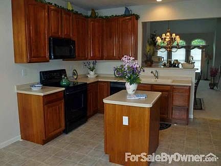 Kitchen
						:
						Large eat-in kitchen features island, all appliances and pantry.