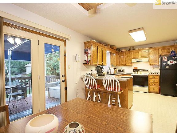 Room for bar stools at the island and has an eat in kitchen that leads to the deck. Great for entertaining!
