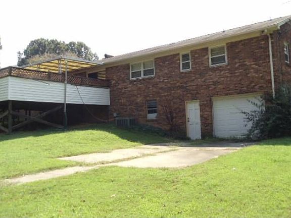 Back with garage door to