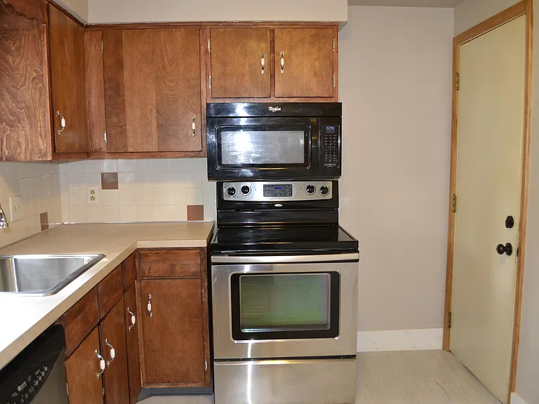 The door pictured is the one most frequently used as an entrance. Kitchen has generous storage.