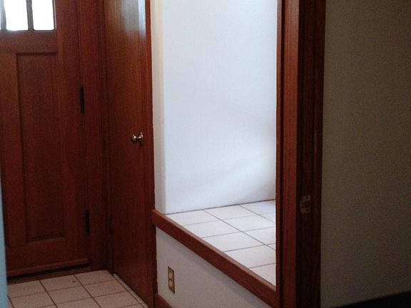 Front door, closets and bay window.