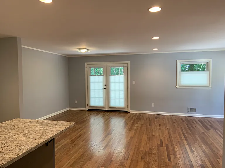 Open the blinds and see all the green trees while still having privacy. Generous yard with mature trees.