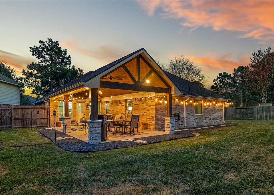 Welcome to peaceful evenings & the perfect hangout at 20907 Jessica Rose Ln! Here is a STUNNING sneak peak of the spacious covered back patio! One of several updates made to the home!