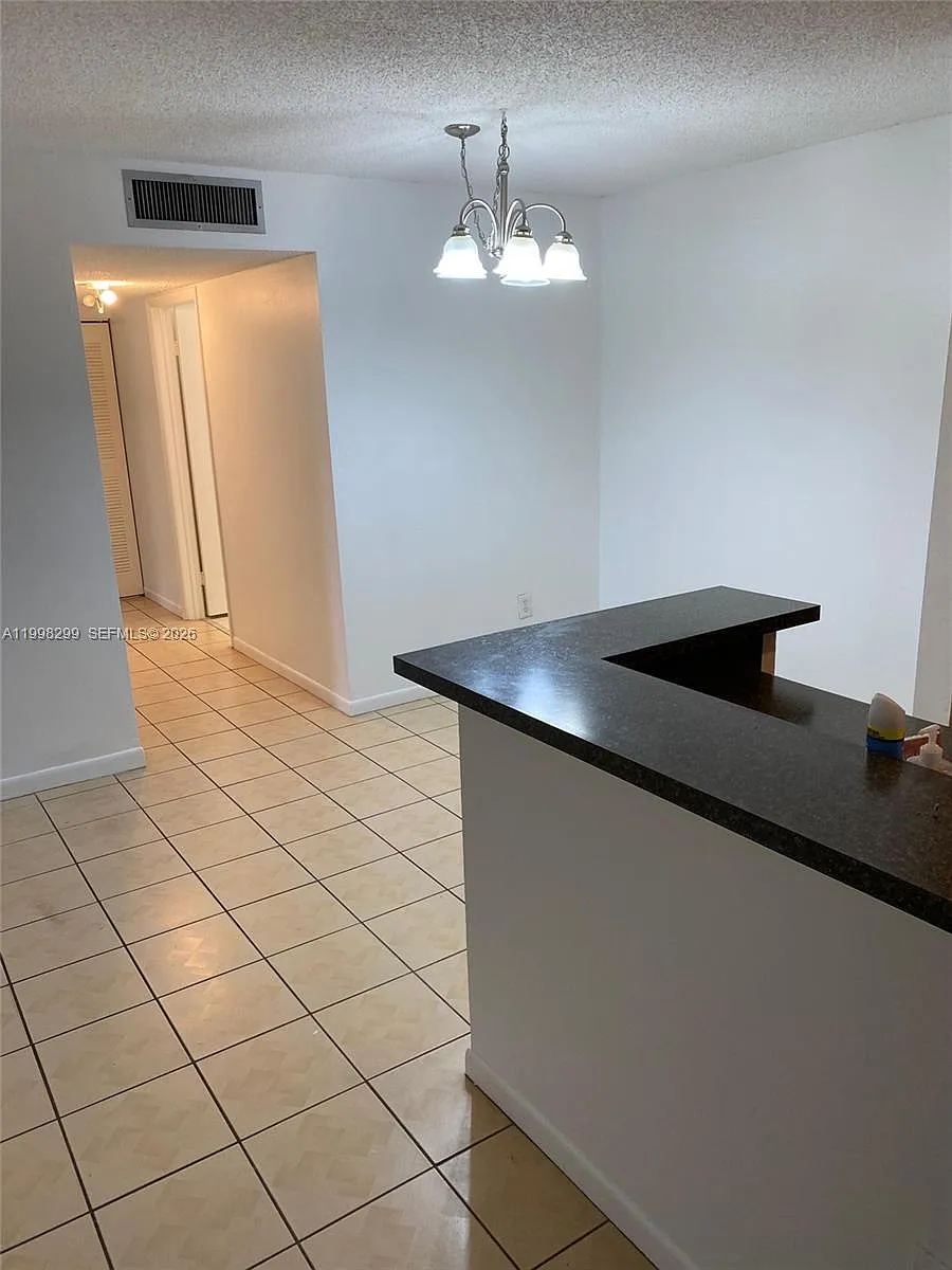 Building Photo - 9608 W McNab Rd #103