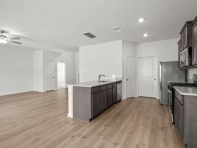 The dining room sits next to the kitchen and family room.